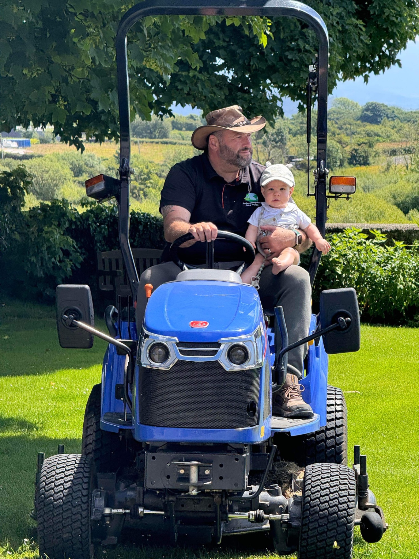 Estyn on the tractor with grandson Freddie